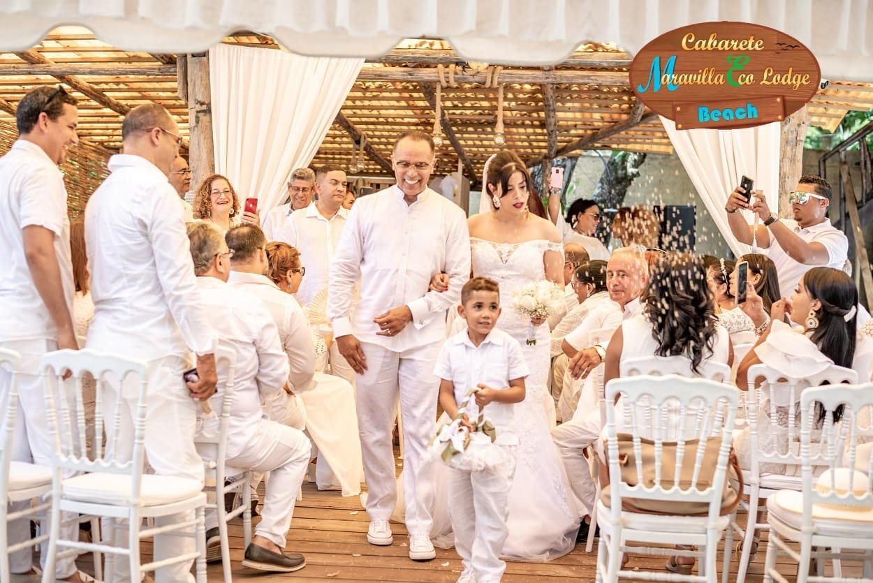 Beachfront wedding party at sunset